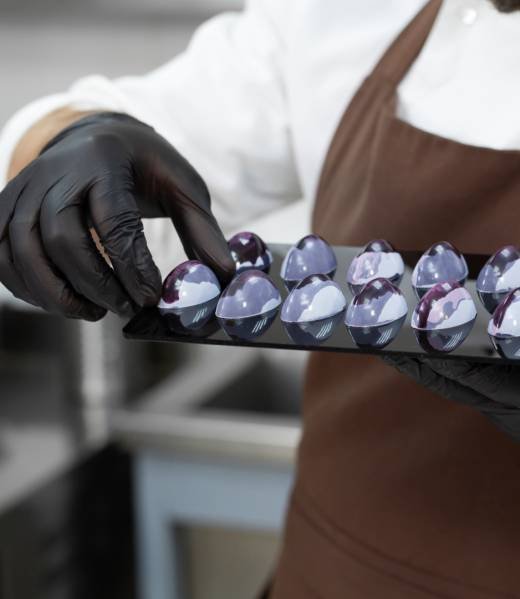 male-pastry-chef-a-man-laying-out-colored-chocolat-2024-08-08-07-06-06-utc-2